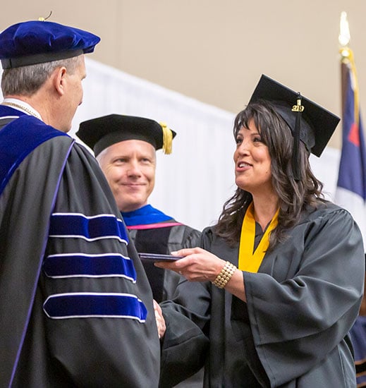 Female student receiving diploma